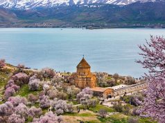 The Answer to All Your Questions A large body of water with a mountain in the background