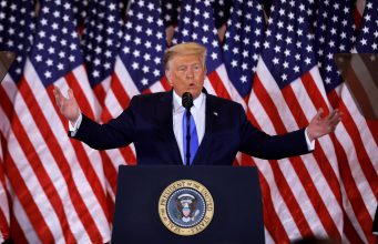 It’s Like Uber, But For American Democracy Donald Trump wearing a suit and tie