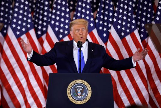 It’s Like Uber, But For American Democracy Donald Trump wearing a suit and tie