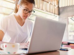 Building A Better Blogosphere A woman sitting at a table using a laptop