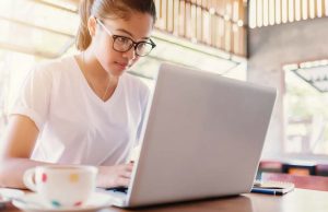 Building A Better Blogosphere A woman sitting at a table using a laptop