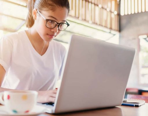Building A Better Blogosphere A woman sitting at a table using a laptop