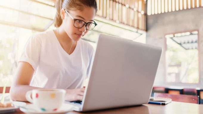 Building A Better Blogosphere A woman sitting at a table using a laptop
