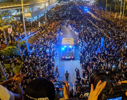How To Start A Revolution A group of people in front of a crowd