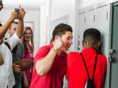 How To Protect Yourself From Bullies A group of people standing in a room