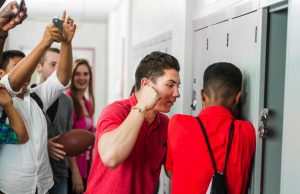 How To Protect Yourself From Bullies A group of people standing in a room