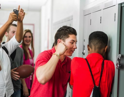 How To Protect Yourself From Bullies A group of people standing in a room