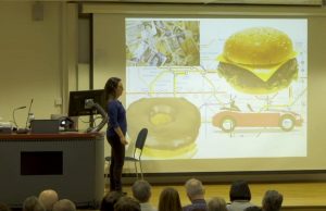 An Introduction To Evolutionary Psychology A group of people standing in front of a television