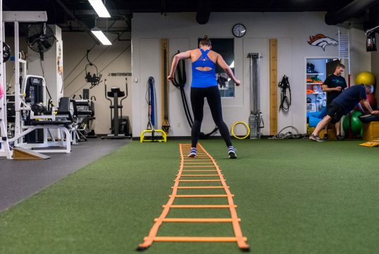 Sports Injury Rehabilitation A group of people standing in a room
