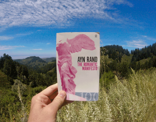 The Thumotic Manifesto A person holding a sign