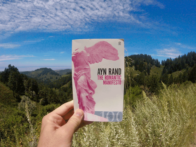 The Thumotic Manifesto A person holding a sign