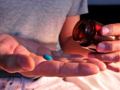 Seven Ways The Red Pill Will Improve Your Life A close up of a hand