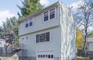 Real Estate In Waltham, Ma A house with trees in the background