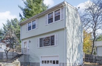 Real Estate In Waltham, Ma A house with trees in the background