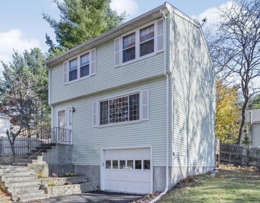 Real Estate In Waltham, Ma A house with trees in the background