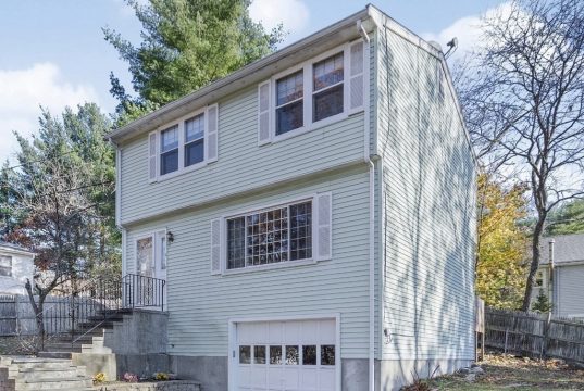 Real Estate In Waltham, Ma A house with trees in the background