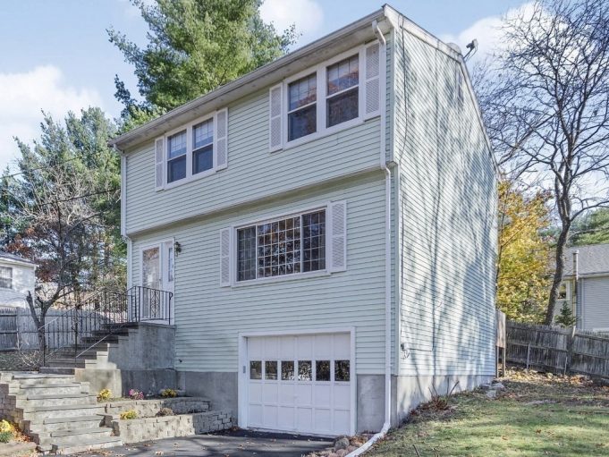 Real Estate In Waltham, Ma A house with trees in the background