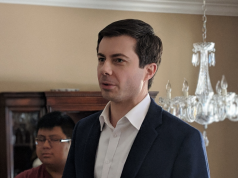 Victimocracy Peter Buttigieg wearing a suit and tie
