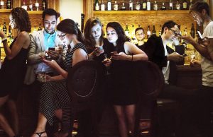 Evil Men Get Laid More Than You A group of people sitting in a restaurant