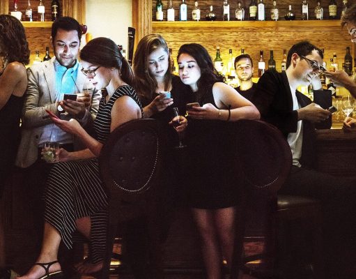 Evil Men Get Laid More Than You A group of people sitting in a restaurant